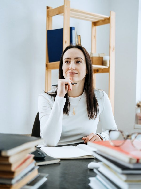 account-balance-definition-female-accountant-working-with-many-books-and-notepads.jpg